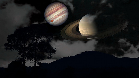 土星和木星在夜空中升起剪影山和云