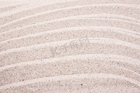 海滩上白沙波纹的抽象背景