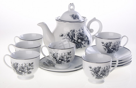 水壶茶壶摄影照片_茶壶，背景上的陶瓷茶壶。