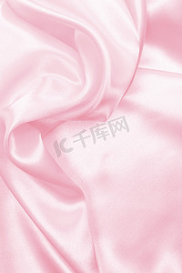 光滑优雅的粉色丝绸或缎子作为婚礼背景