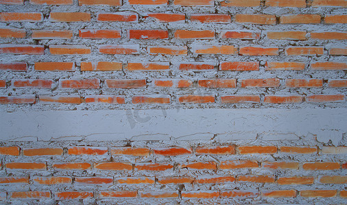 空荡荡的旧砖墙漆成质感快乐的红棕色墙宽垃圾砖墙破旧的建筑，上面覆盖着损坏的石膏抽象网页横幅白色复制空间。