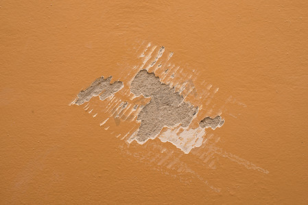 油漆划痕摄影照片_墙上的油漆刮刀标记