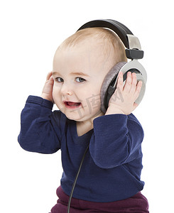 不幸的是摄影照片_带耳机听音乐的幼儿