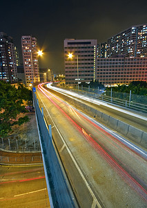 城市模糊夜景摄影照片_桥梁和城市的夜景