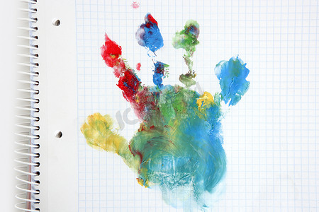 教育手绘蓝色摄影照片_笔记本上彩色手绘打印