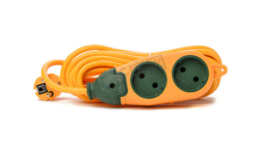 三条竖线摄影照片_白色背景上隔离的三个插座的橡胶橙色电源板