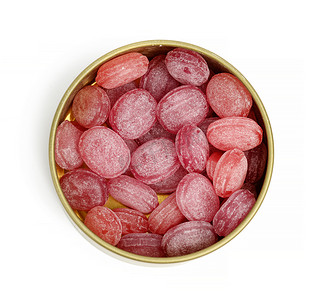 棒棒糖粉色背景摄影照片_白色背景中开放式圆形锡罐中的椭圆形水果棒棒糖