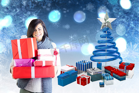 礼物的圣诞树摄影照片_微笑的黑发女郎拿着许多礼物的合成图像
