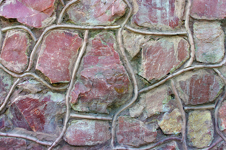 不规则图圈摄影照片_传统石砖墙由不规则的碎片石头制成