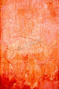 橙色的 grunge 墙裂纹纹理