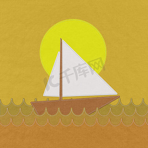 海洋风格背景摄影照片_海中的船，织物背景上有缝线风格