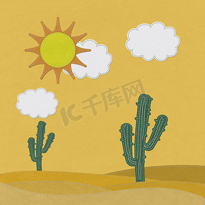 亚利桑那的阳光摄影照片_沙漠中的仙人掌，织物背景上有针法