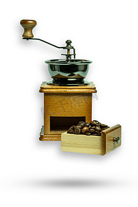 咖啡机和咖啡豆摄影照片_手磨机和咖啡豆。