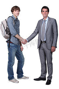 行政章摄影照片_学生与老师握手