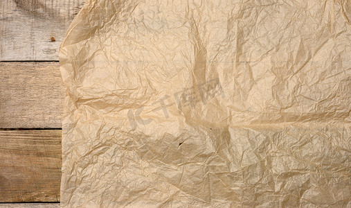 复古质感摄影照片_皱巴巴的空白棕色包装牛皮纸，设计师的复古质感