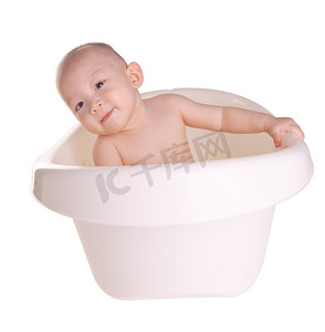 洗澡浴缸摄影照片_“宝贝男孩，亚洲可爱的宝宝在浴缸里洗澡”