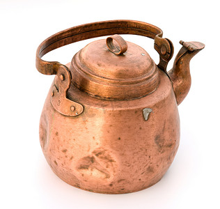 煮茶茶壶摄影照片_铜制的旧茶壶。