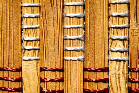 黄色交织摄影照片_竹茎背景与螺纹交织在一起。