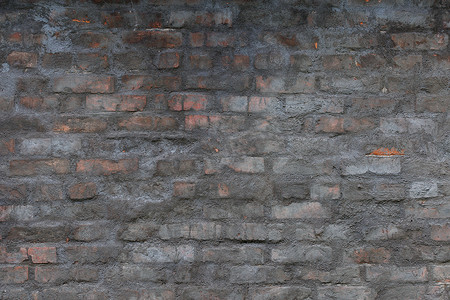 有破旧的灰色水泥膏药层数的老砖墙