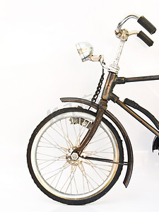 铁制背景摄影照片_白色背景下孤立的铁制自行车模型前轮
