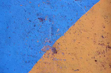 蓝色和黄色彩绘混凝土背景