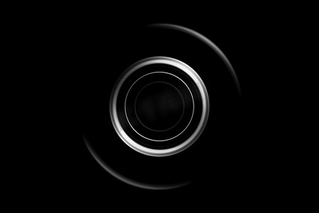 圆圈抽象摄影照片_黑色背景上带环形灯的抽象白色圆圈