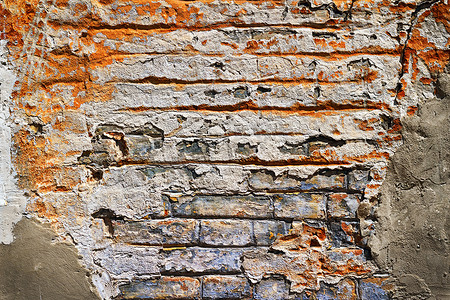 砖瓦工摄影照片_Grunge 纹理的旧砖与石膏碎