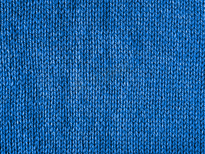 蓝色毛线摄影照片_蓝色针织球衣作为 2020 年的颜色背景