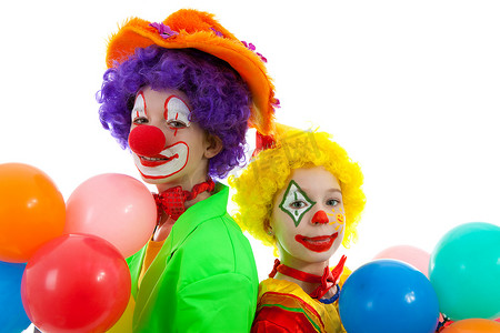 小丑巡游摄影照片_两个孩子打扮成五颜六色的滑稽小丑的肖像