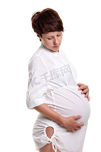 一件白色衬衣的怀孕的少妇