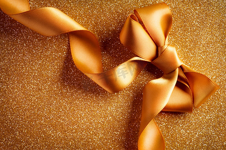 假日 Background.Greeting Card.Gold Bow on a Blinking Backgrou