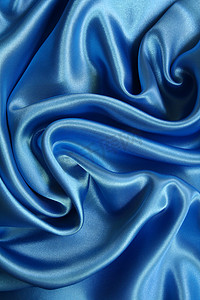光滑优雅的深蓝色丝绸可以用作背景光滑的 elega