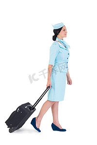 带着手提箱走路的漂亮空姐