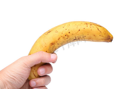 手里拿着一根不新鲜的香蕉
