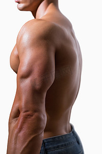 肌肉男成人摄影照片_一个光着膀子的肌肉男的侧视图