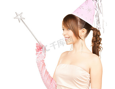学生活动节摄影照片_戴着魔术棒的派对帽的女孩