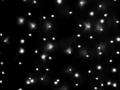 黑白圣诞花环的散焦灯均匀分布在框架、背景、纹理区域