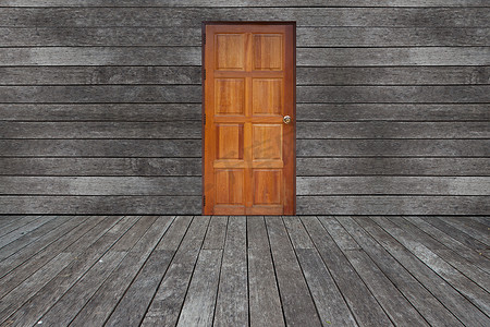 有门和地板壁板的墙壁被风化的木头背景