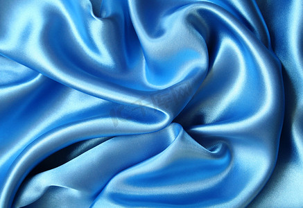 深蓝色布料摄影照片_光滑优雅的深蓝色丝绸可以用作背景