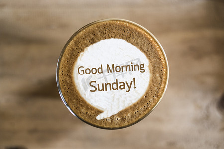 周日早安摄影照片_咖啡拿铁艺术概念的早安周日