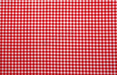 红方格桌布摄影照片_红白格子桌布。