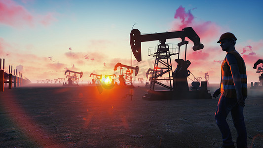 橙色电商背景摄影照片_在万里无云的美丽天空背景下，石油工人在日出时检查油泵。 