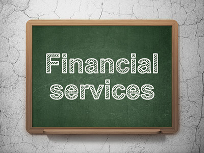 金融服务摄影照片_货币概念： 黑板背景上的金融服务
