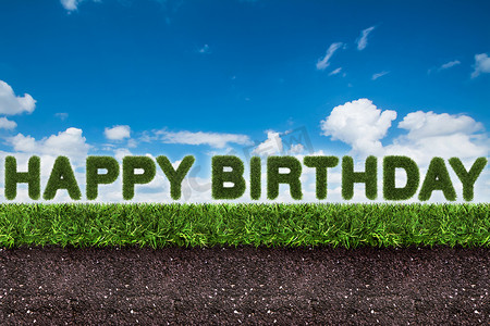 天然农场字摄影照片_绿草上的生日快乐文字，蓝天上的土壤，3d 渲染