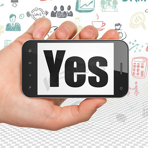 图标yes摄影照片_财务概念： 手持智能手机与 Yes 上显示
