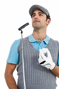 拿着高尔夫球和高尔夫球杆站立的高尔夫球手