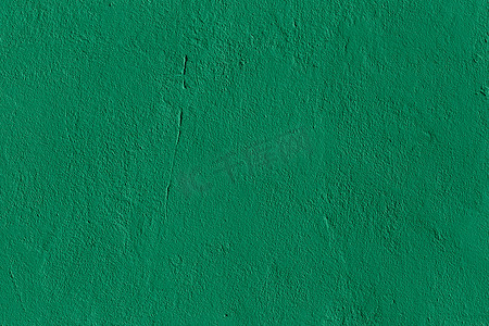 磨砂墙背景摄影照片_扁平的薄荷绿色石膏墙磨砂质感