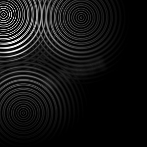 在黑色背景上振荡的抽象白色圆环声波