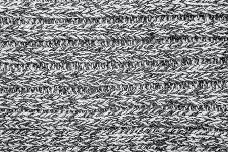 混合编织线毛衣或围巾作为背景。