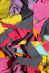 彩色拼凑图案摄影照片_背景彩色织物纺织品碎片